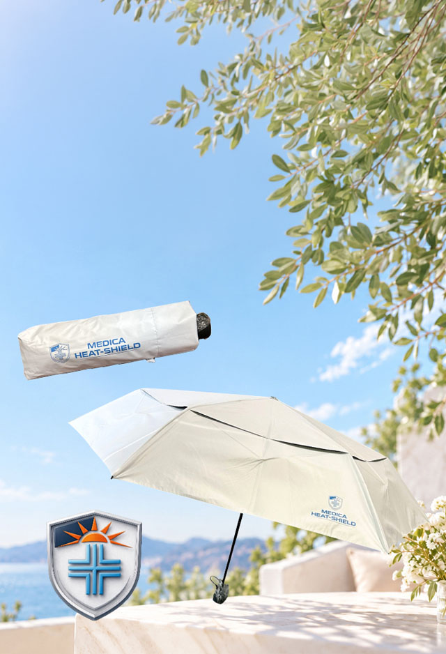 Walking comfortably under a MEDICA-HEAT SHIELD® umbrella on a hot sunny day