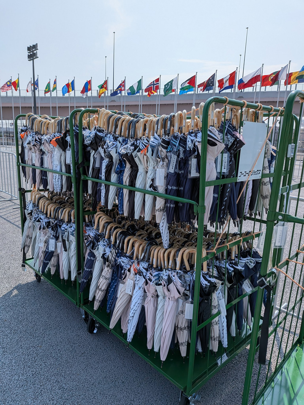 Loan umbrellas ready on racks at the Main Gate of Expo 2025 Osaka, Kansai, Japan